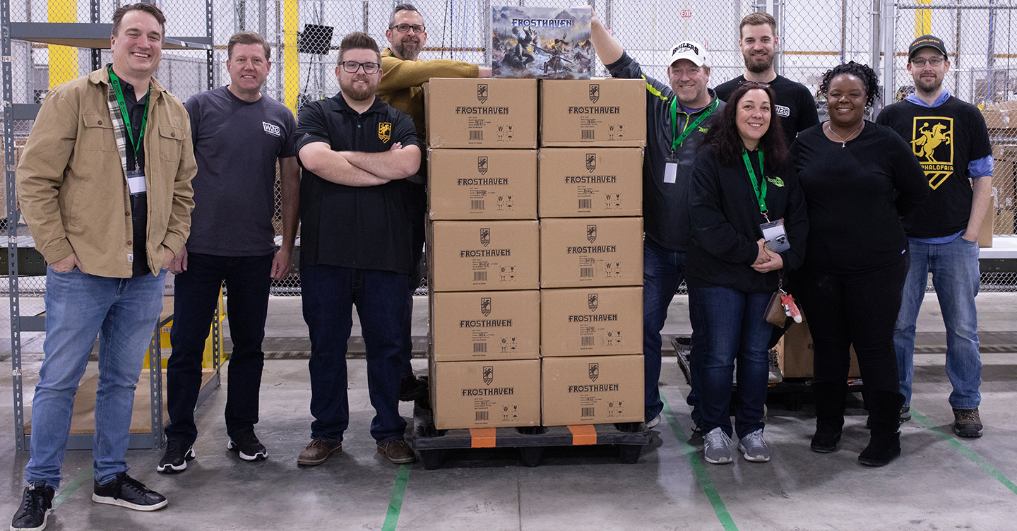 Employees Posing for Picture with Boxes