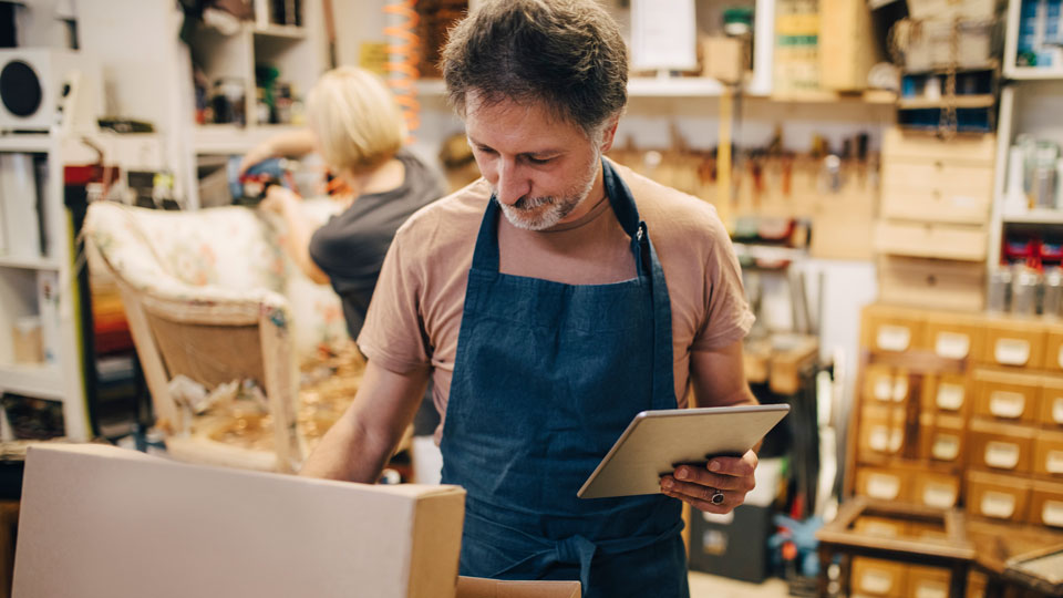 Man prepares package for cross-border shipping