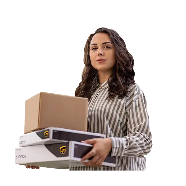 Woman is holding UPS boxes.