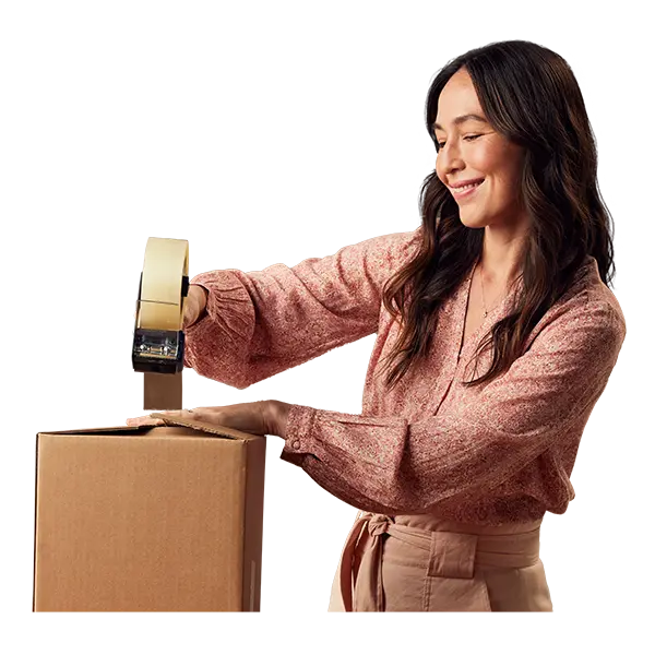 Woman taping up a box.