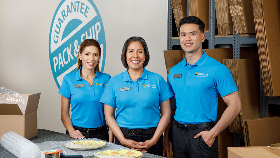 Three UPS Store Employees Smiling