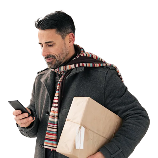 A man looking for UPS locations on mobile while holding a package