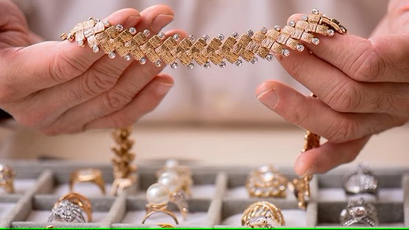 Jeweler Showing Golden Necklace