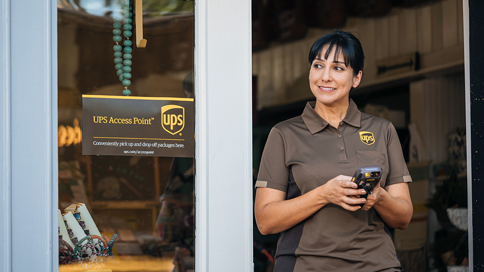UPS driver with a package scanner