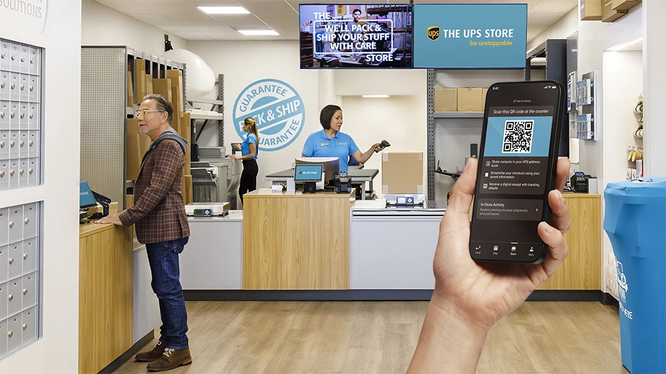 Person getting ready to scan their UPS QR code at The UPS Store.