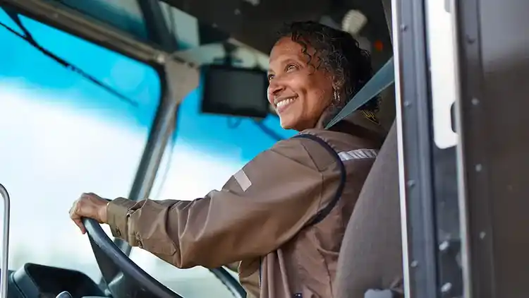 Woman driving a UPS van